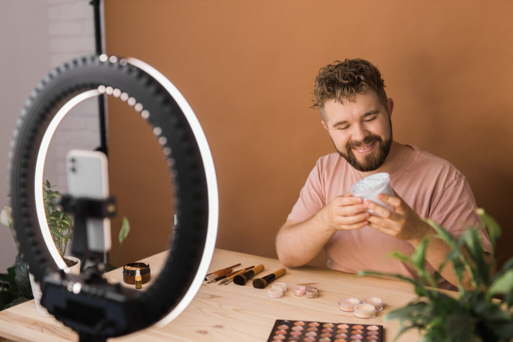 male micro influencer showing cosmetic products